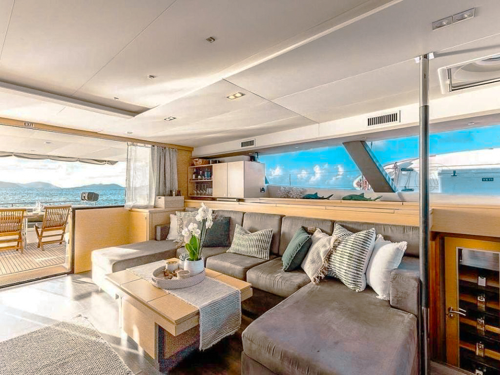 Guests relaxing on the deck of 70 Fountaine Pajot II enjoying the view