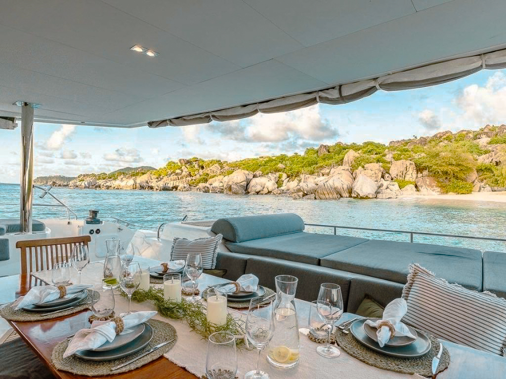 Luxurious main salon of 70 Fountaine Pajot II with seating and dining area