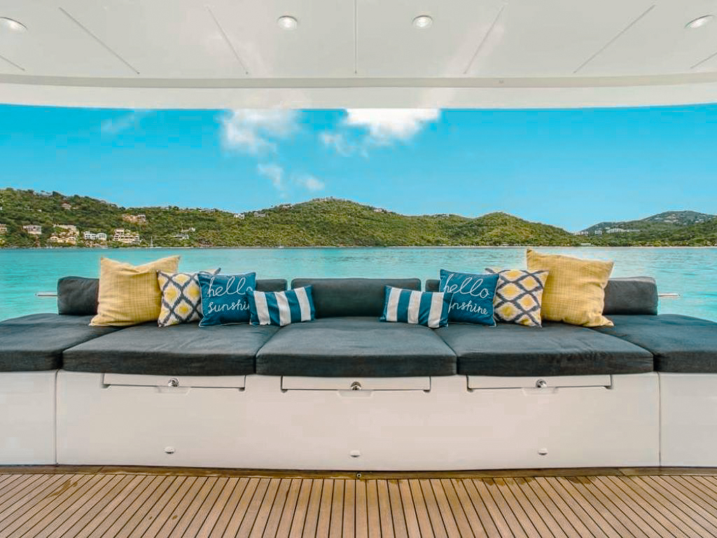 View of 65 Lagoon II yacht on the water with Caribbean islands in background