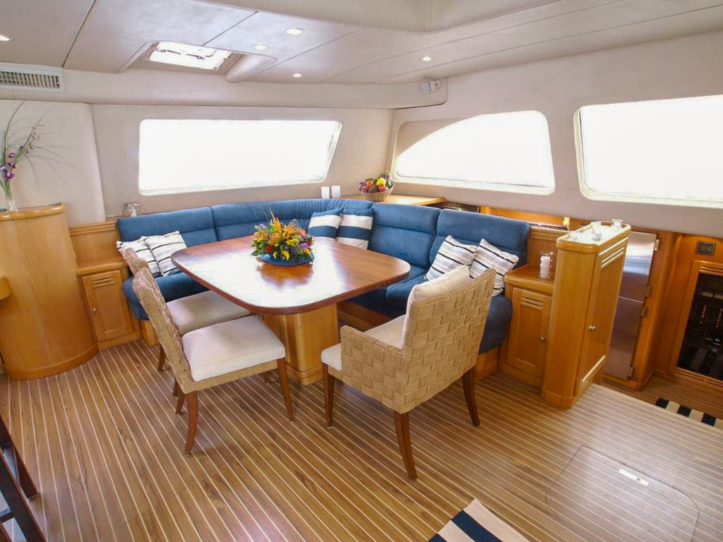 Dining area on the aft deck of 63 Leopard yacht with ocean view