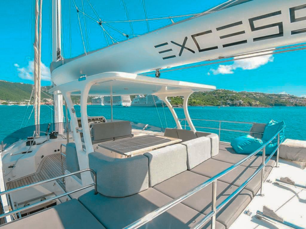 A group enjoying a meal on the deck of 70 Sunreef yacht
