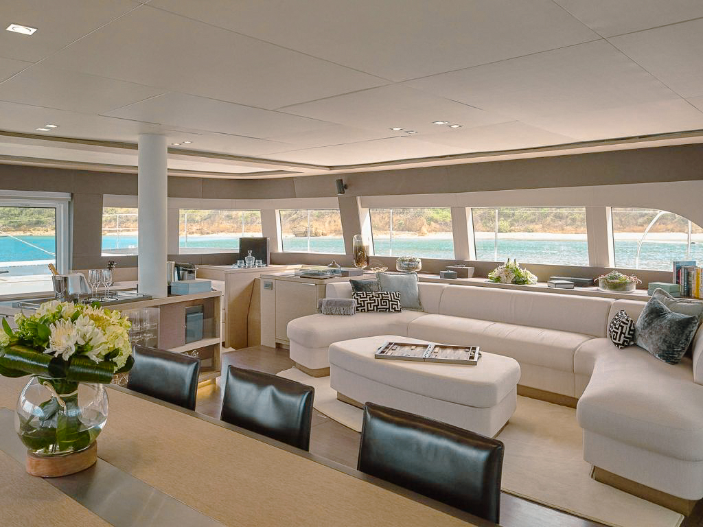 Guests relaxing on the foredeck of 76 CNB Bordeaux with ocean view