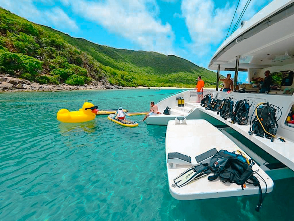 A guest resting on the deck of 76 Matrix yacht, Caribbean
