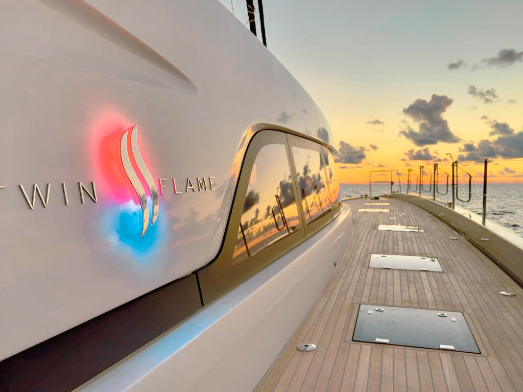 Guests relaxing on the front deck of 78 Lagoon III yacht with sea views