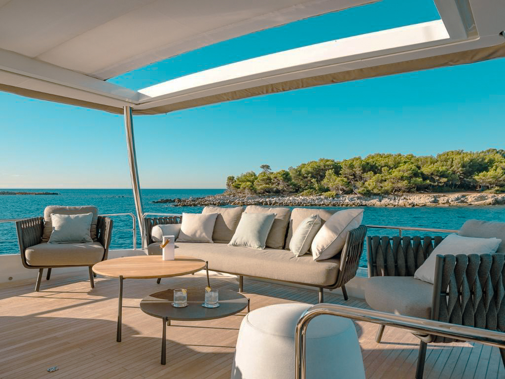 People relaxing on the bow of 78 Lagoon II yacht