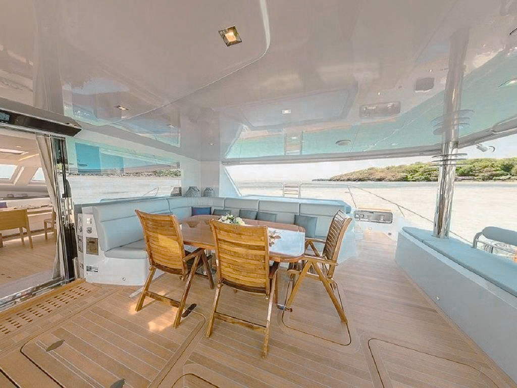 Guests enjoying water slide from 78 Privilege yacht