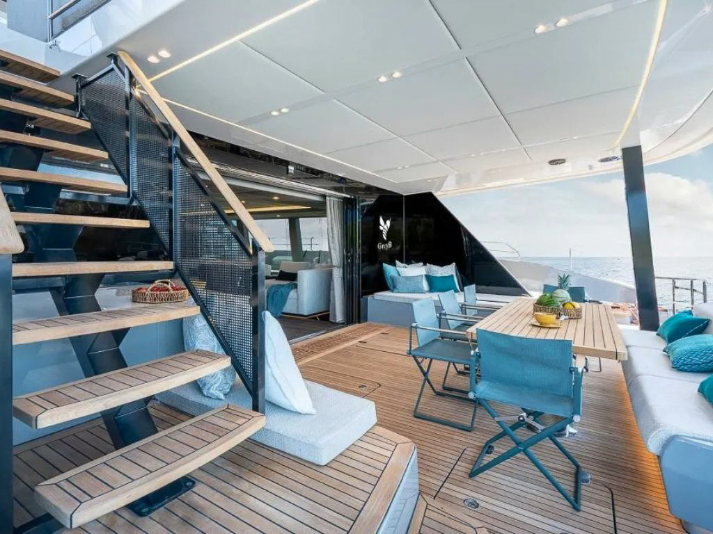 80 Sunreef VI yacht at anchor in a beautiful bay