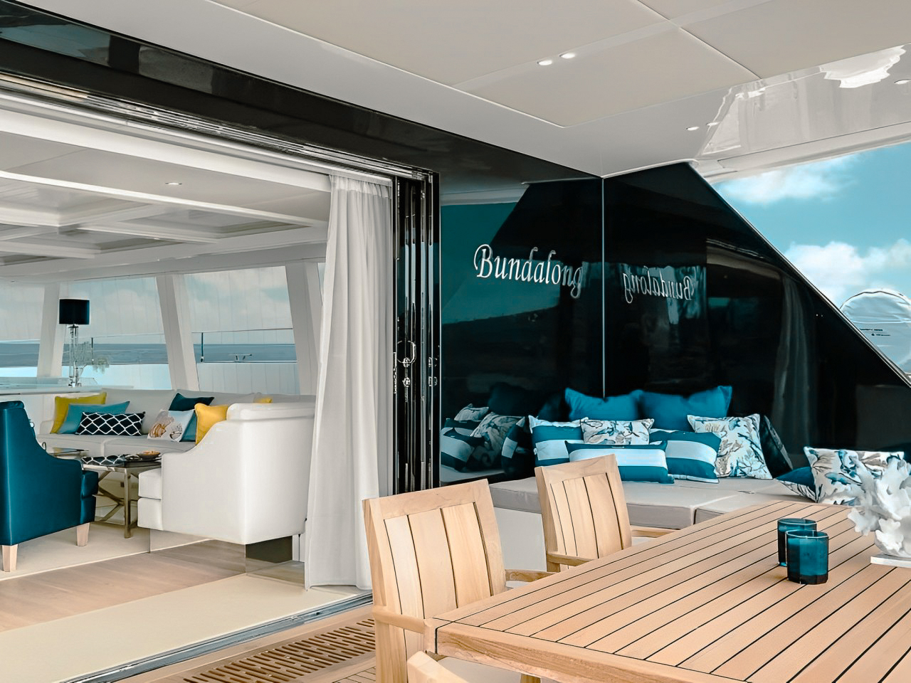 Rear view of 80 Sunreef II with swimming platform deployed and water slide