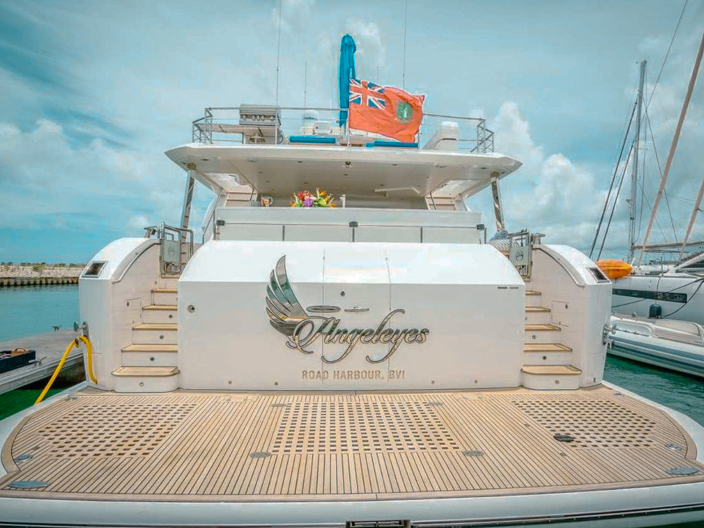 Side view of the 85 Horizon yacht at anchor, showing its sleek design