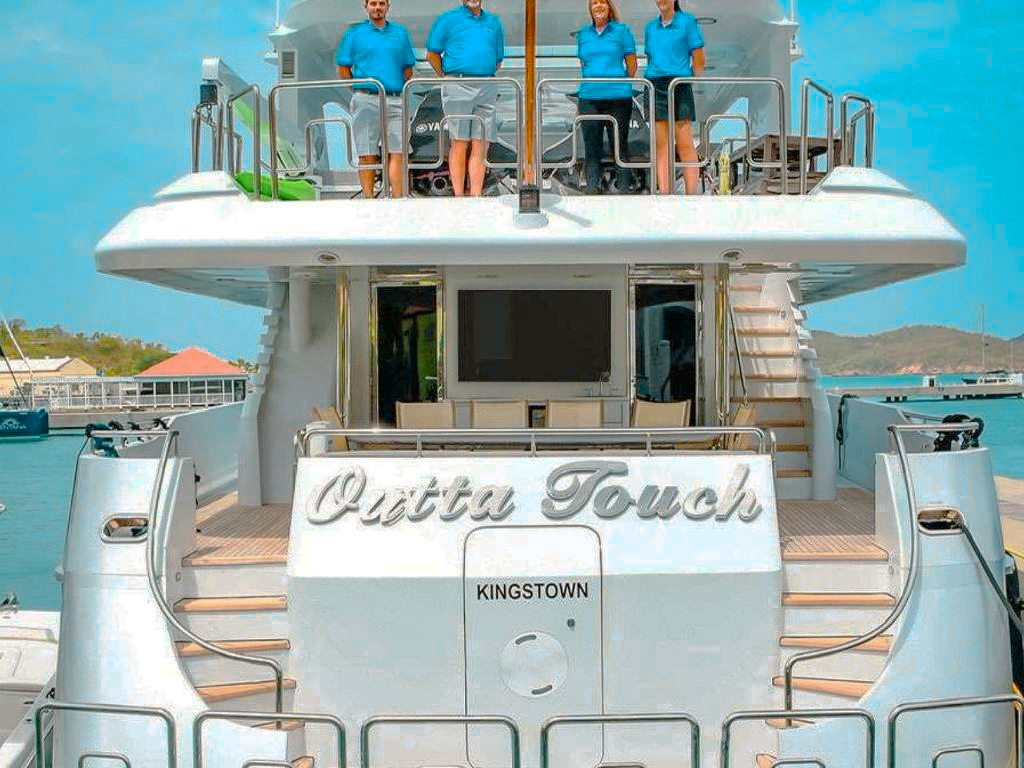 People enjoying the sundeck of 104 Intermarine yacht in Caribbean