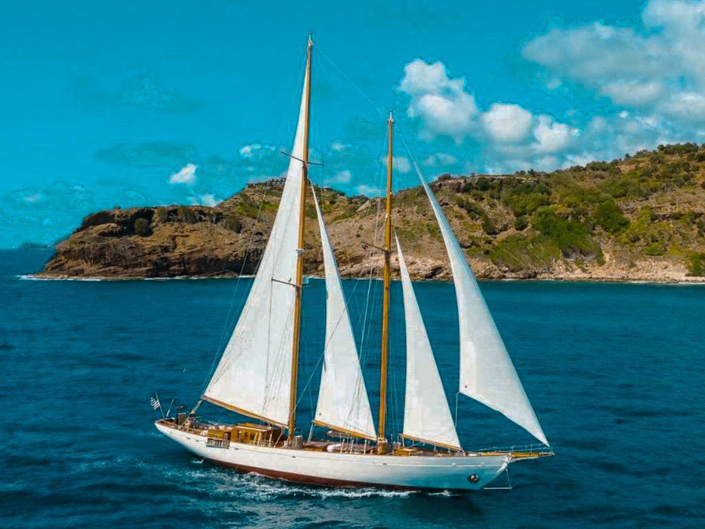 Side view of the classic 115 Brooks Marine yacht against a blue sky