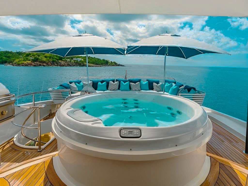 A group enjoying water activities off the stern of the 116 Lazzara yacht