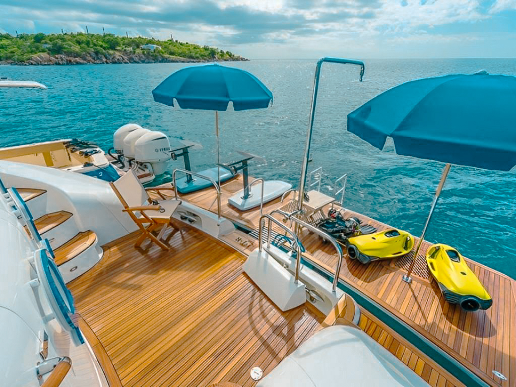 Stern of the 116 Lazzara with a water slide extending into the ocean