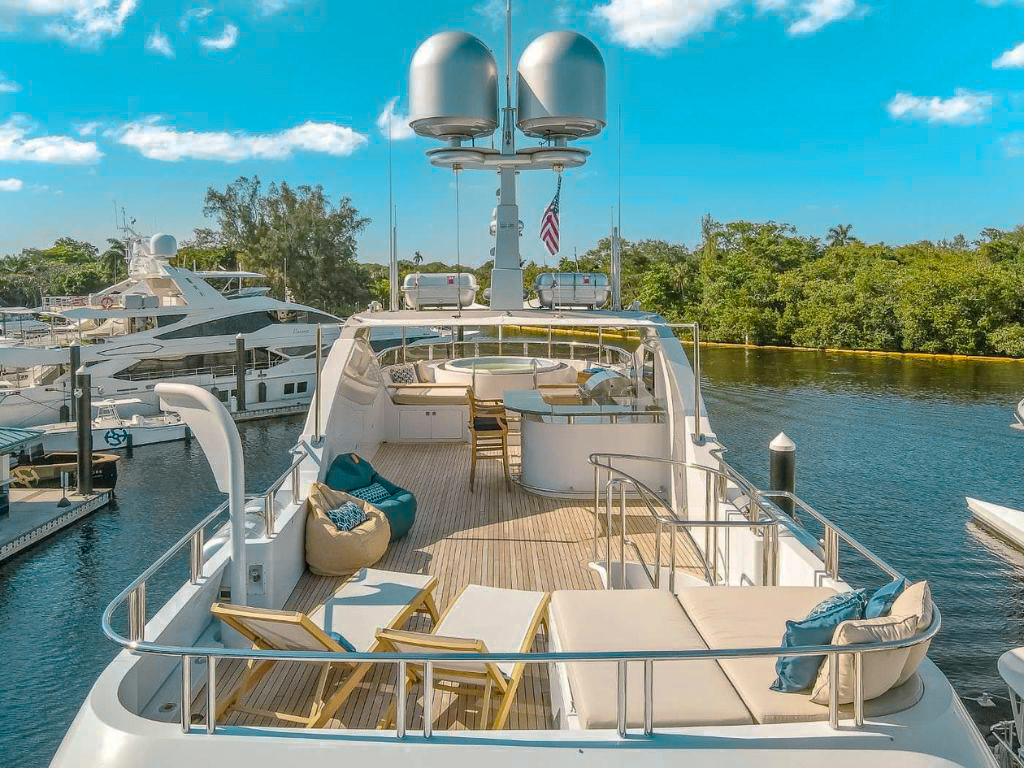 Aft deck of 141 Ares Marine with dining table and seating