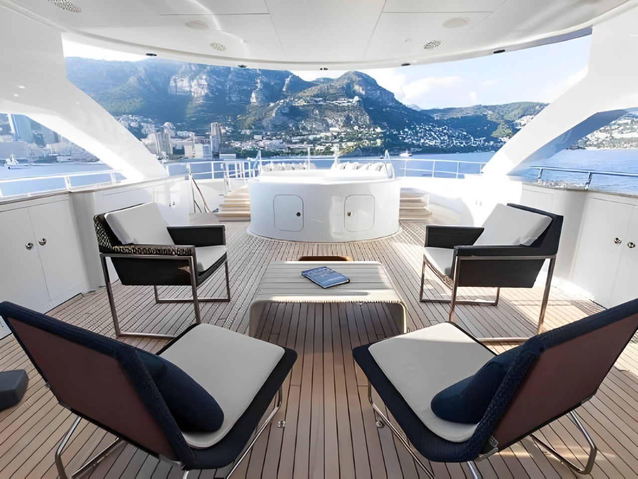 155 Heesen yacht's aft deck with dining area and ocean view