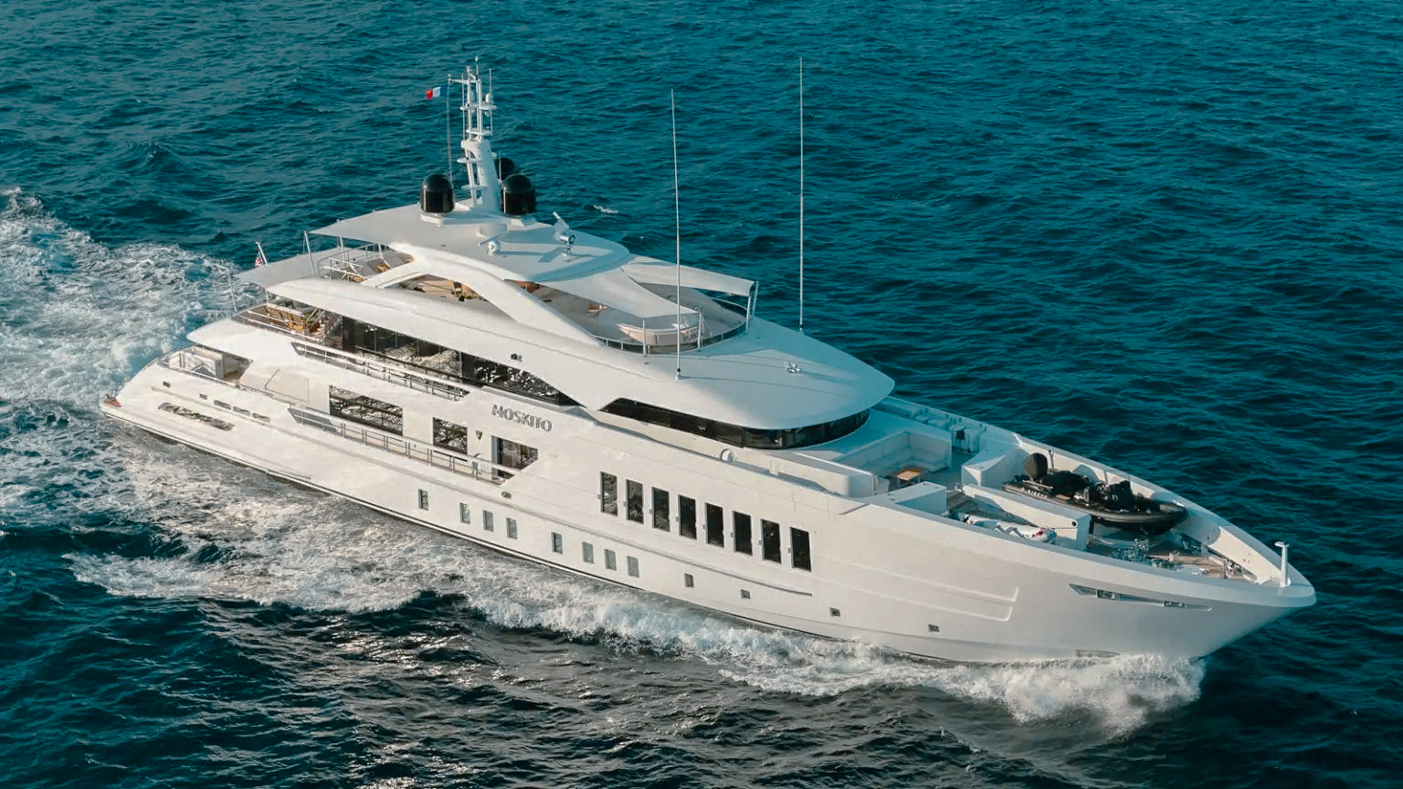 Panoramic view of a luxury catamaran anchored in the breathtaking turquoise waters off Virgin Gorda, British Virgin Islands, surrounded by lush green hills