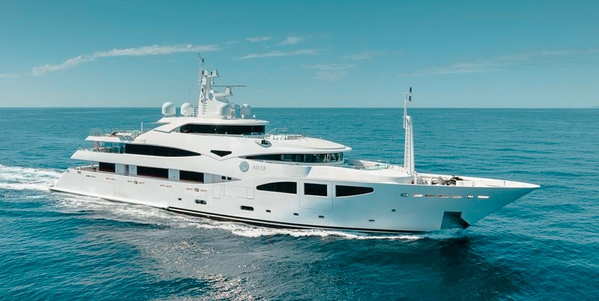 196ft CRN yacht sailing in clear blue Caribbean waters with luxury amenities on deck