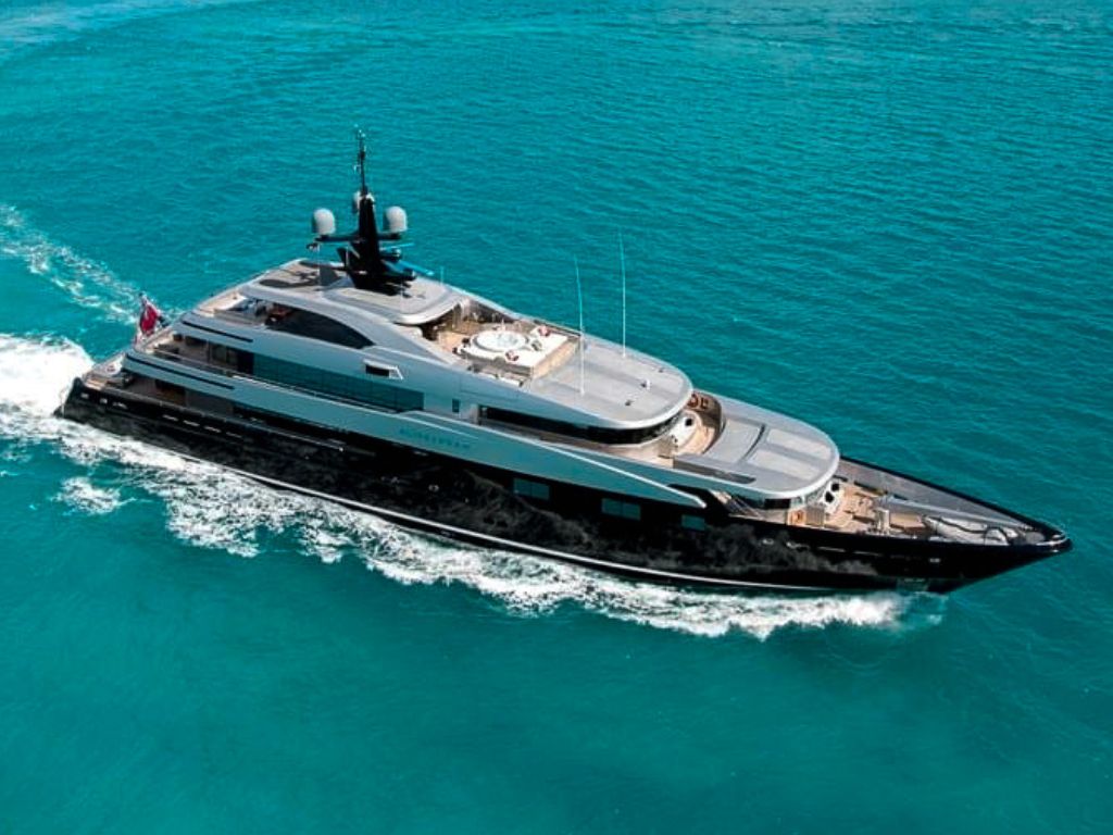 197ft CMN yacht sailing in the turquoise Caribbean waters with guests enjoying the sun