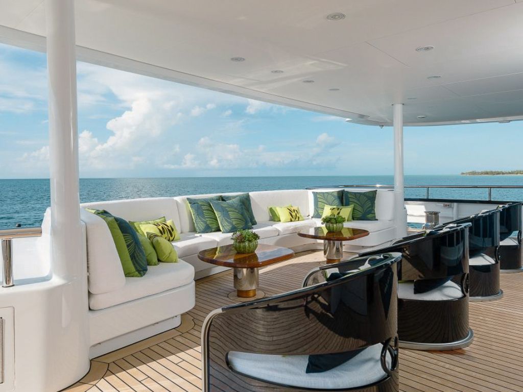 Dining area on the exterior deck of the 197 Abeking &amp; Rasmussen yacht
