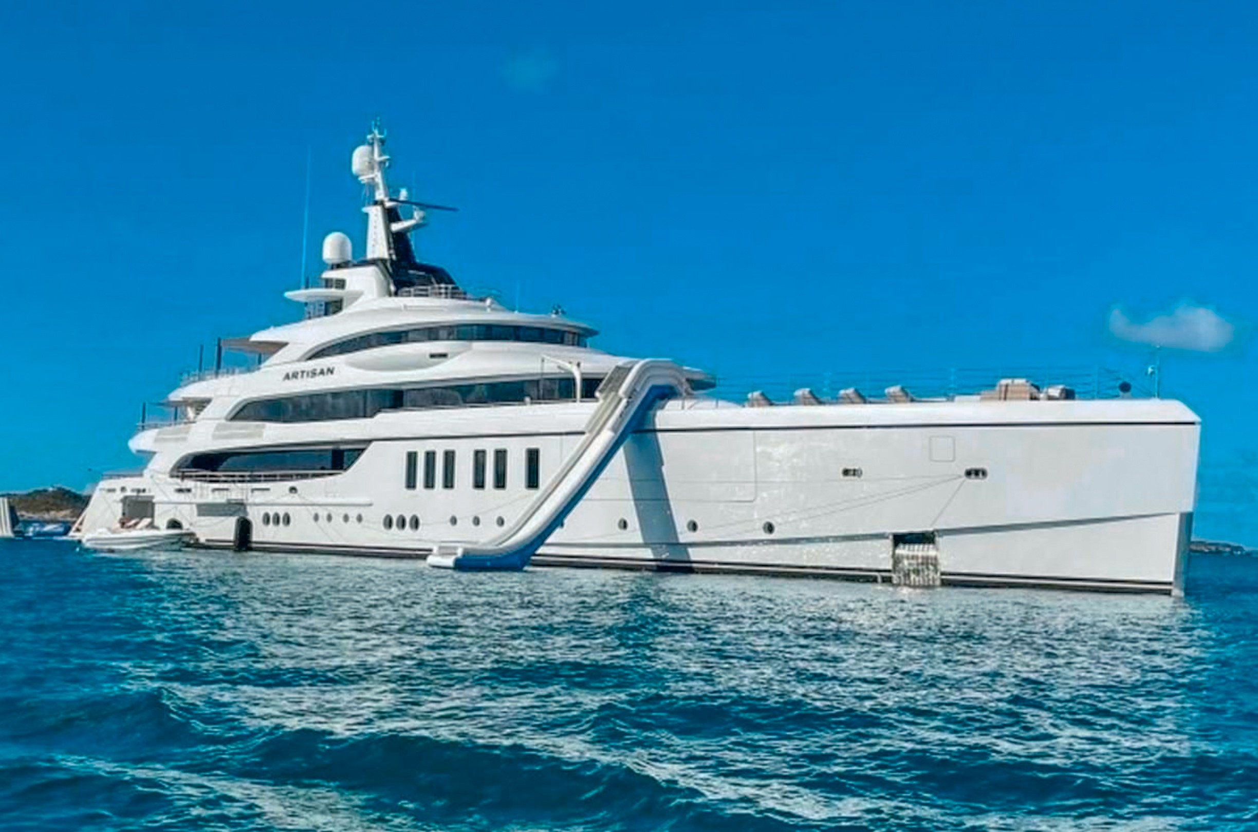 The 208ft Benetti II yacht sailing on clear blue Caribbean waters, offering luxury charters.