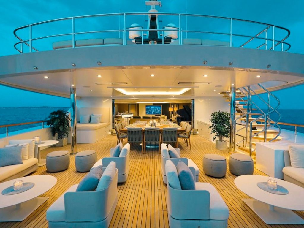 A spacious and luxurious cabin on the 208 Benetti II yacht with a large bed and ample lighting.