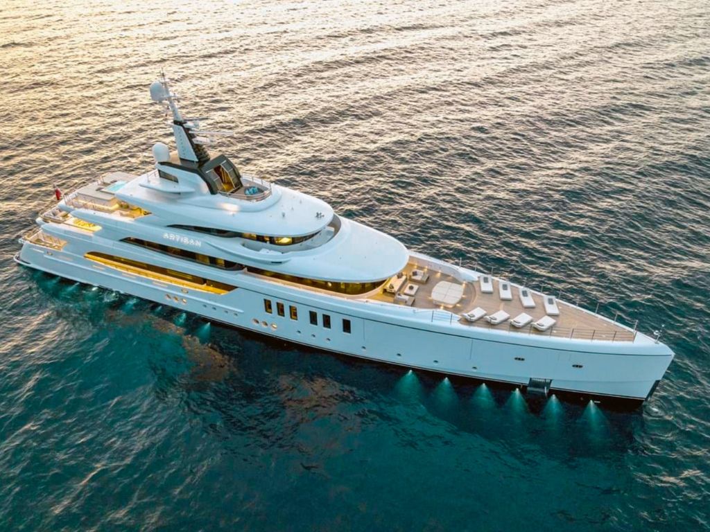 The 208 Benetti II yacht seen from the side, showcasing its sleek design on calm ocean waters.