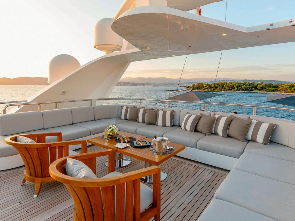 Luxury dining setup on the deck of the Benetti 213 yacht