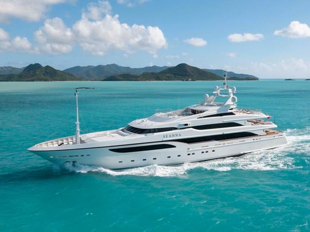 Luxurious 213 Benetti yacht sailing in the clear blue waters of the Caribbean.