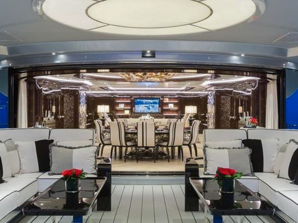 Guests relaxing on the spacious upper deck of the 218 Isa yacht