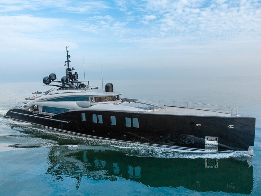 Luxurious 218ft ISA yacht sailing on sparkling Caribbean waters, perfect for a private charter holiday.