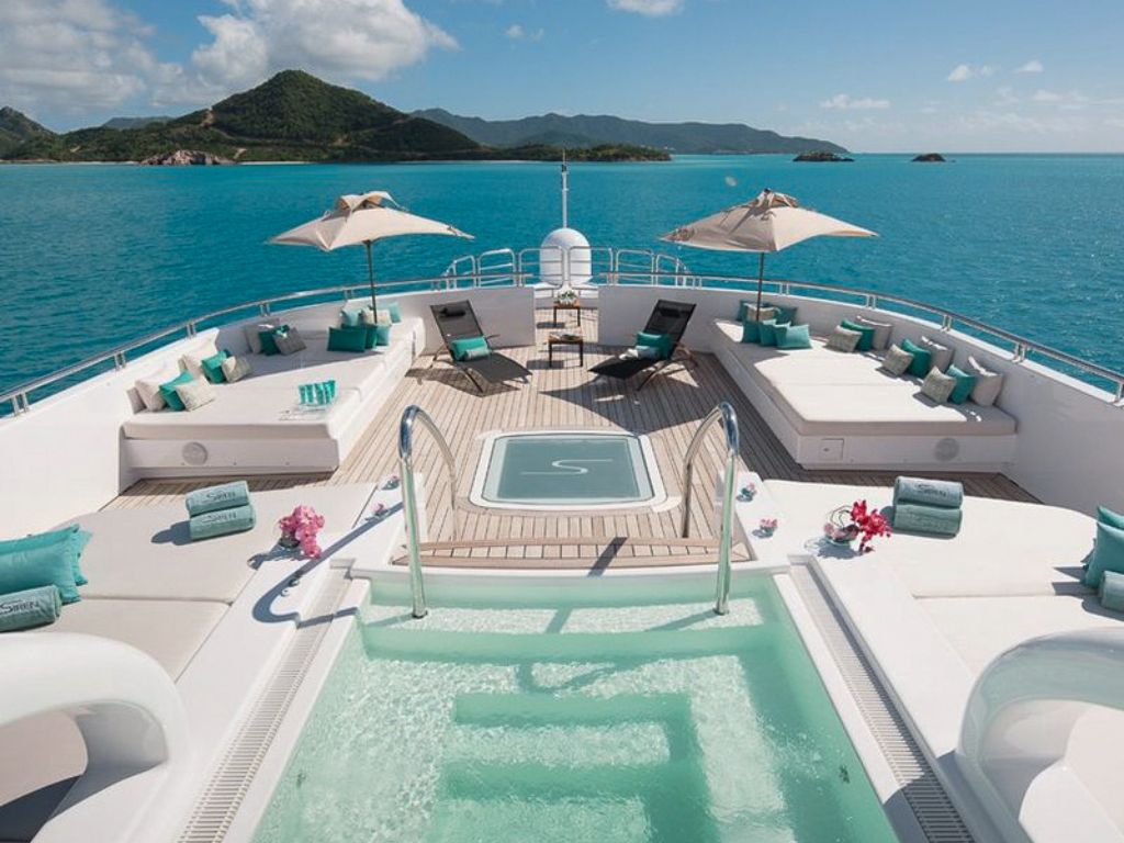 People enjoying water slide from 241 Nobiskrug yacht