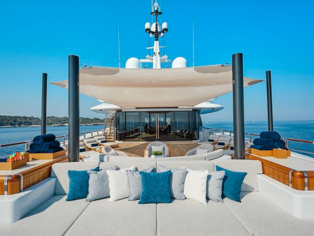 The sun deck with a lounging area on 290 Oceanco yacht