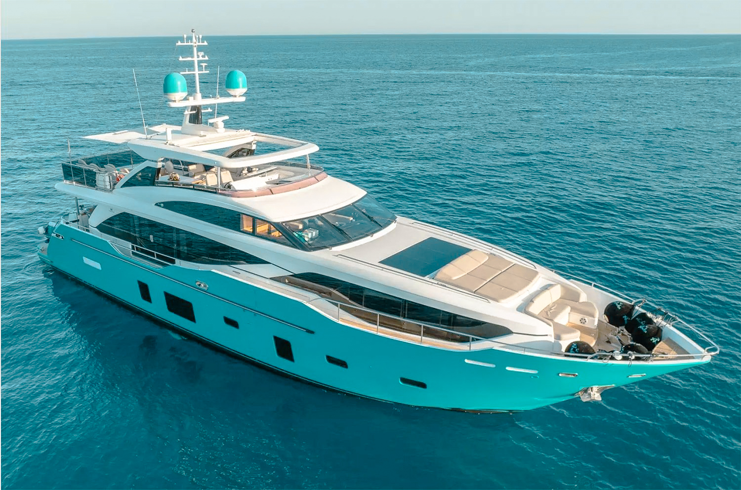 Exterior view of 99 Princess yacht cruising through blue water
