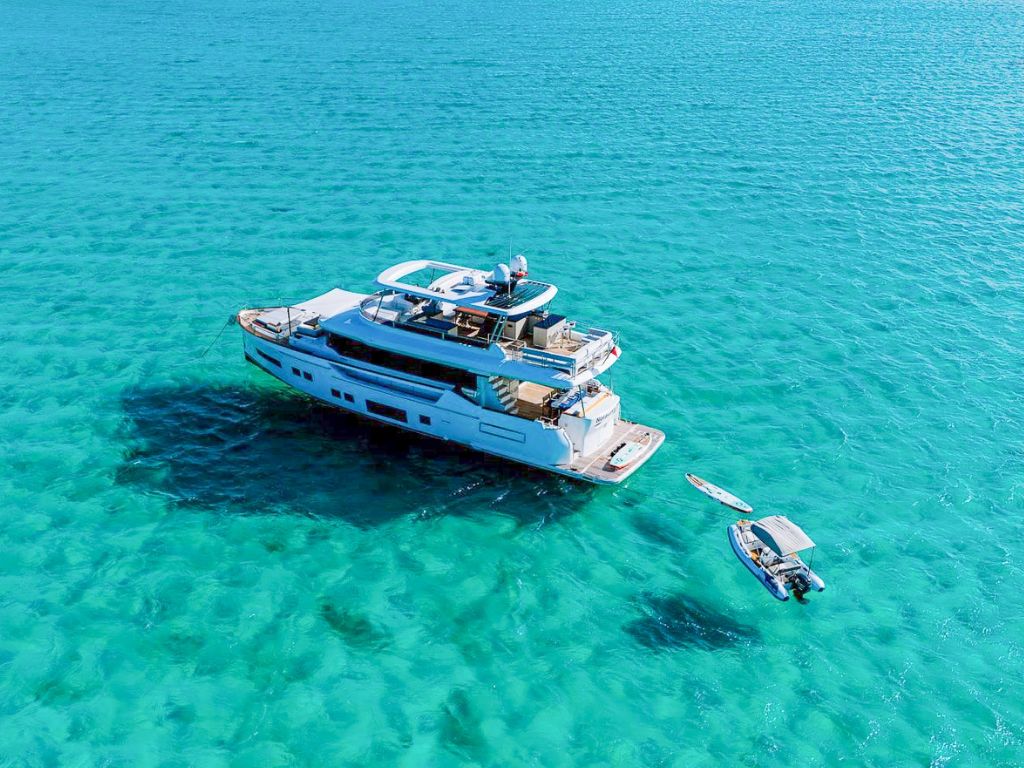 Guests enjoying the sunpads on 68 Sirena yacht