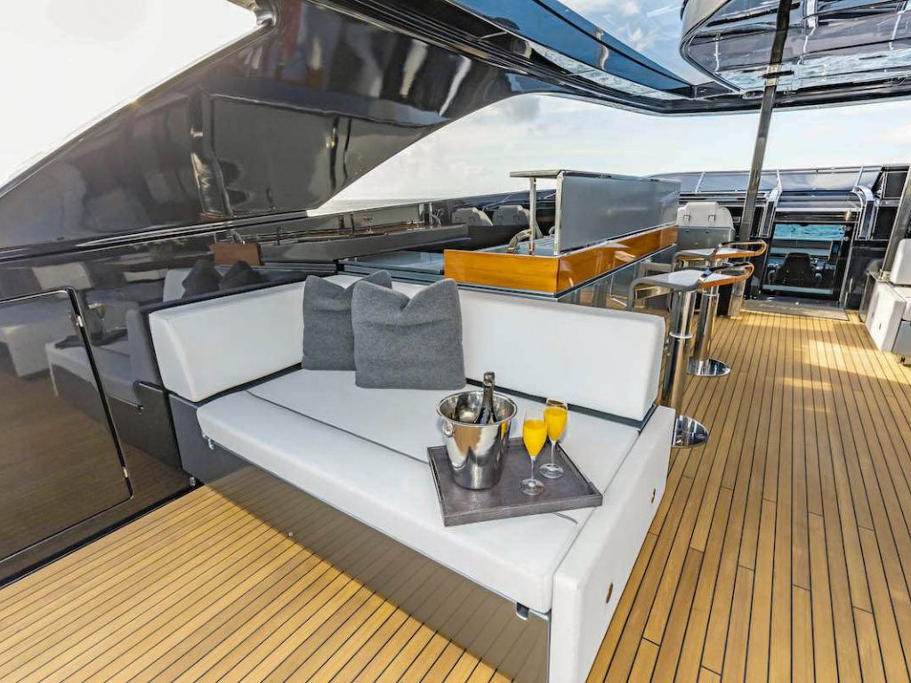 A group enjoying water activities from the stern of the 110 Riva