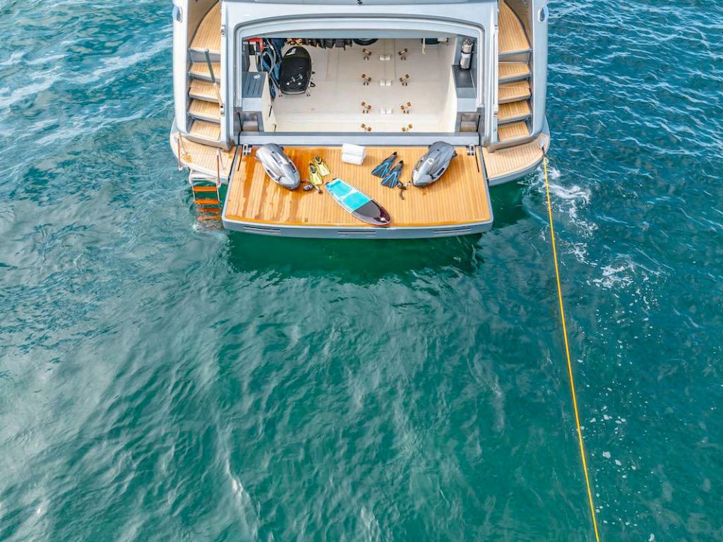 Side view of the 110 Riva yacht cruising in Miami waters