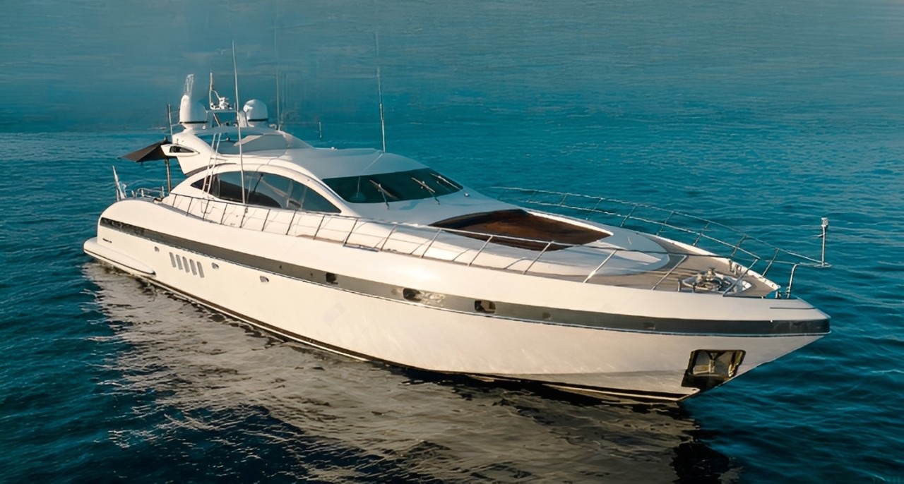 The stunning 92 Mangusta superyacht cruising the beautiful Italian coast for an unforgettable charter experience.