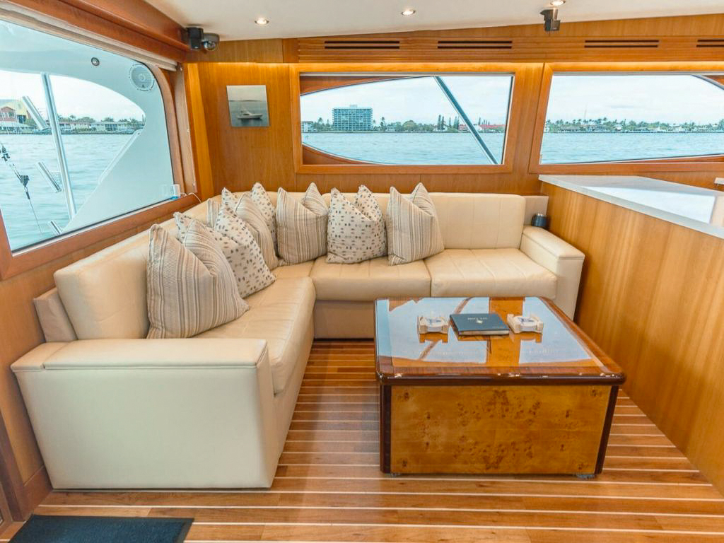 A group enjoying the bow of the 60 Hatteras yacht