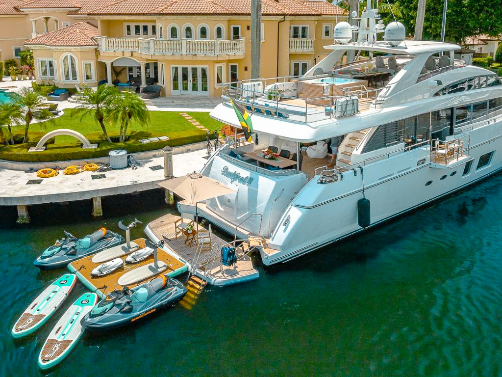105ft Princess yacht sailing through clear turquoise Bahamian waters during a luxury charter