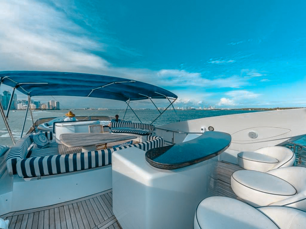 Upper deck of the 82 Sunseeker II with seating and a small table