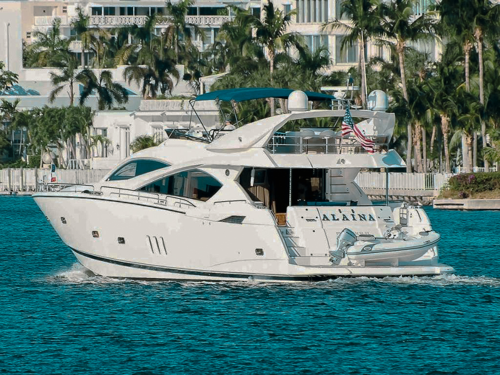 Side view of the 82 Sunseeker II yacht docked, showing its size and sleek design