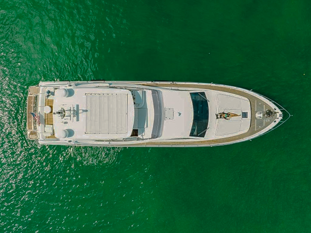 76 Ferretti yacht interior salon with comfortable seating and large windows