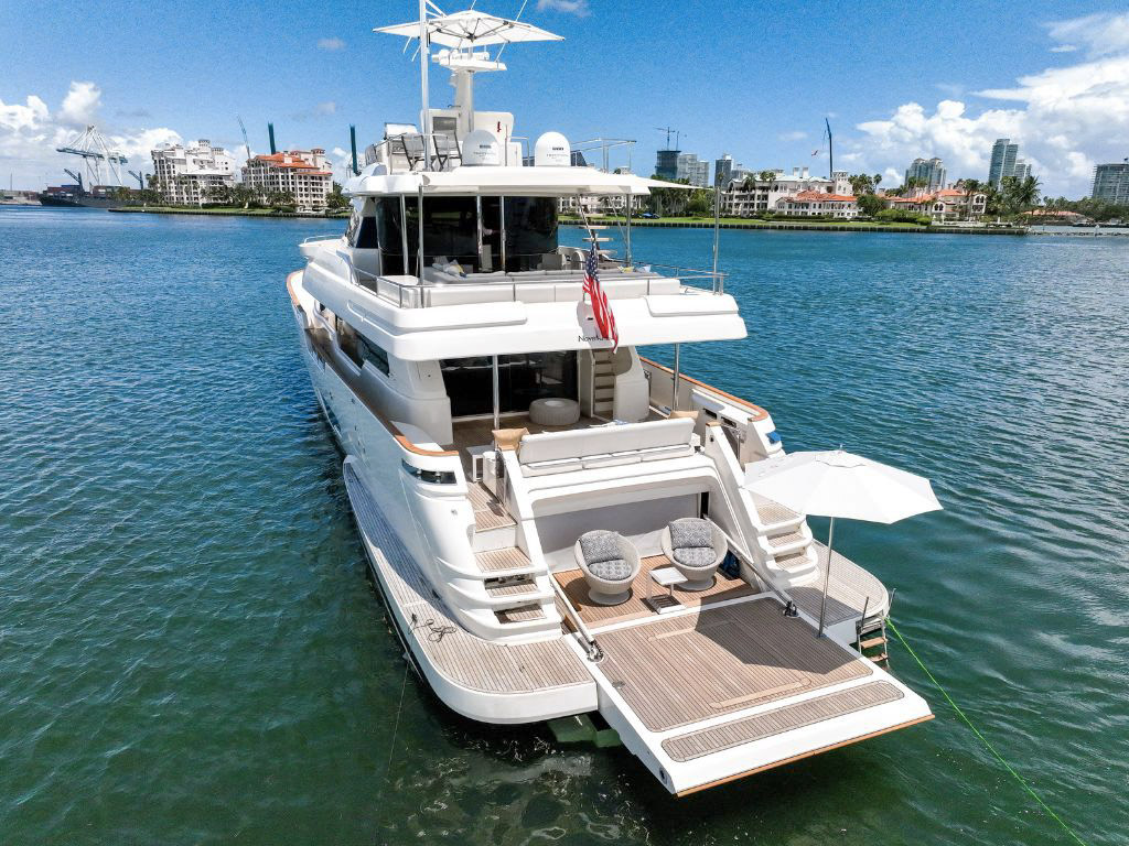 Luxurious 94ft Custom Line yacht docked in Miami, ready for charter and exploration.