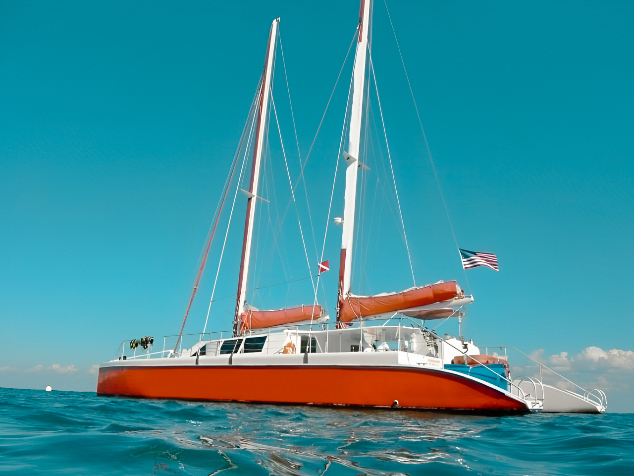 Spacious deck of the 80 Sailing yacht with guests lounging