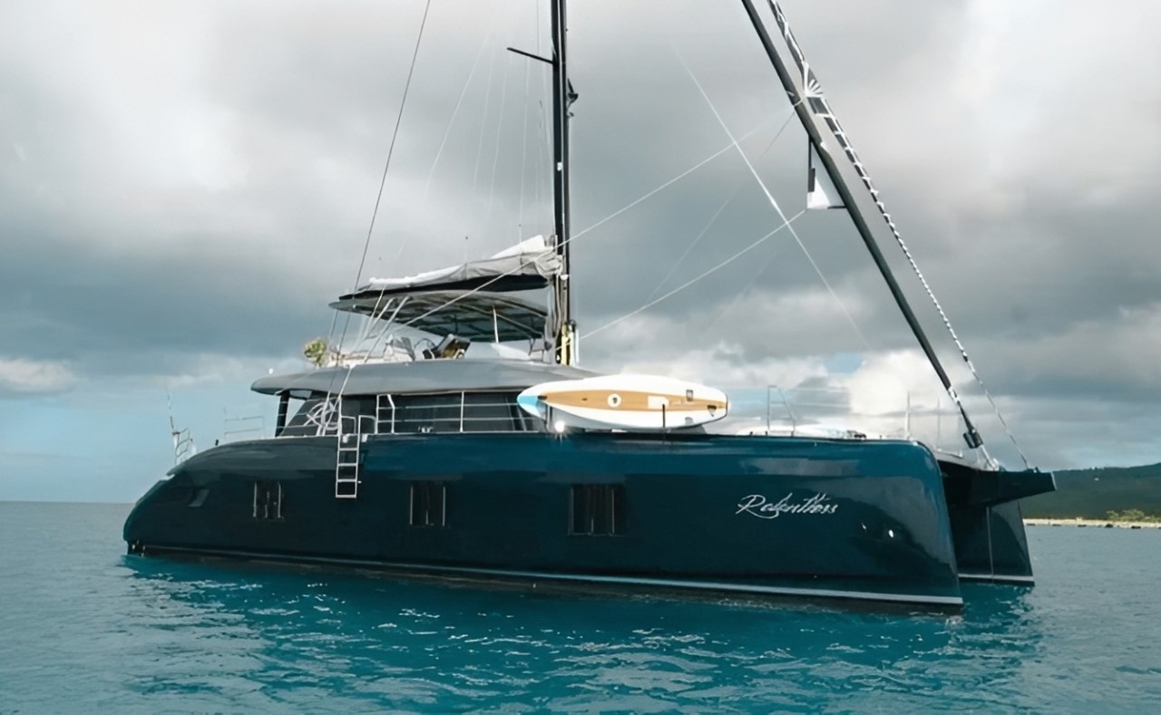 The luxurious 60ft Sunreef II catamaran sailing in the clear blue waters of the Caribbean Sea.