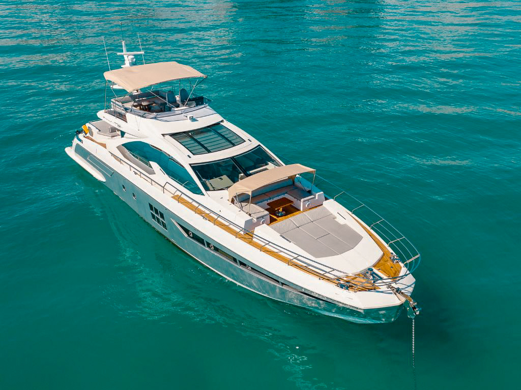 77 Azimut S yacht with guests enjoying the sunpad