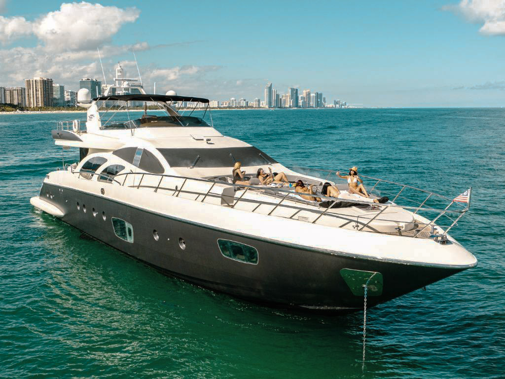 A guest enjoying the jacuzzi on the deck of the 100 Azimut yacht