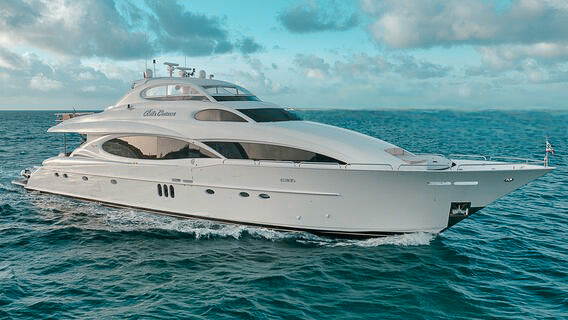 Expansive 112ft Lazzara yacht cruising the turquoise waters of Fort Lauderdale.