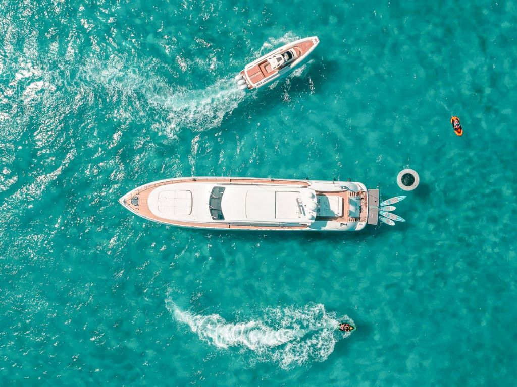 Side view of the sleek 109 Mangusta yacht on the water