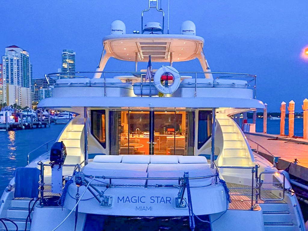 Front deck of the 62 Power Cat II with sunpads and seating